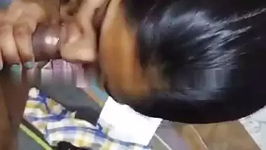 Cute girlfriend in bra giving blowjob to boyfriend